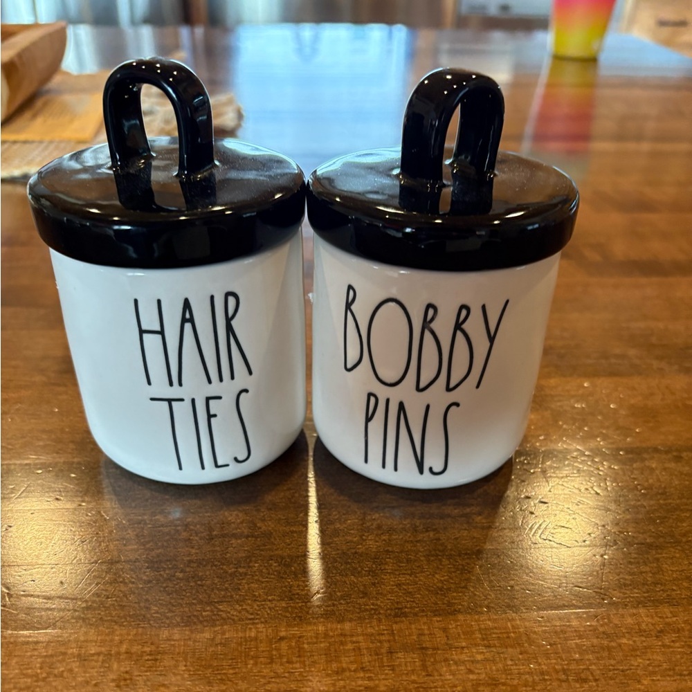 Rae Dunn hair ties and bobby pins canister.